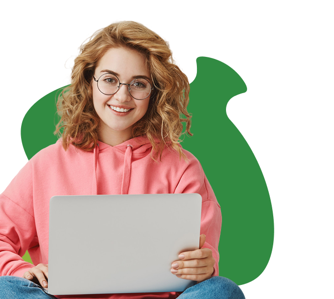 girl on laptop with green acorn in background