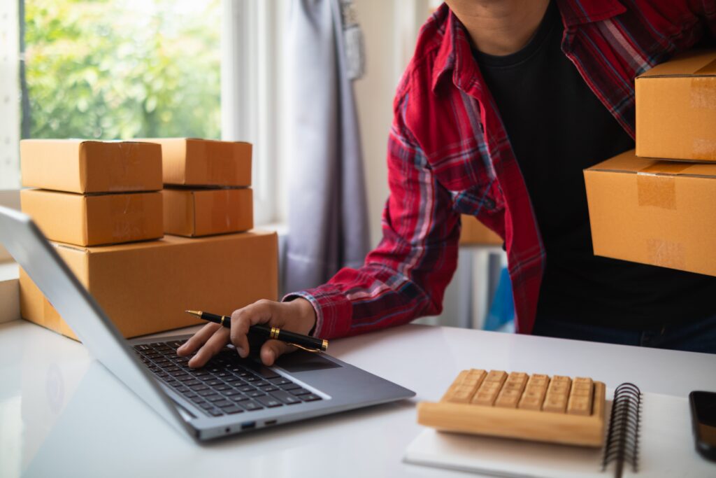 E-commerce business owner working on laptop